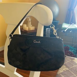 Black coach wristlet.